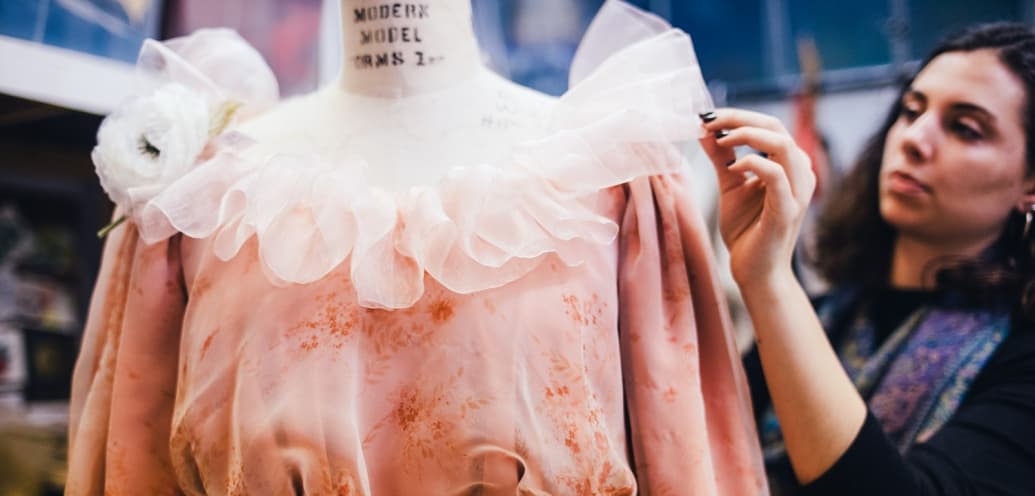 Senior Lydia Megalaa works on a costume for SPU Theatre’s production of An Ideal Husband.