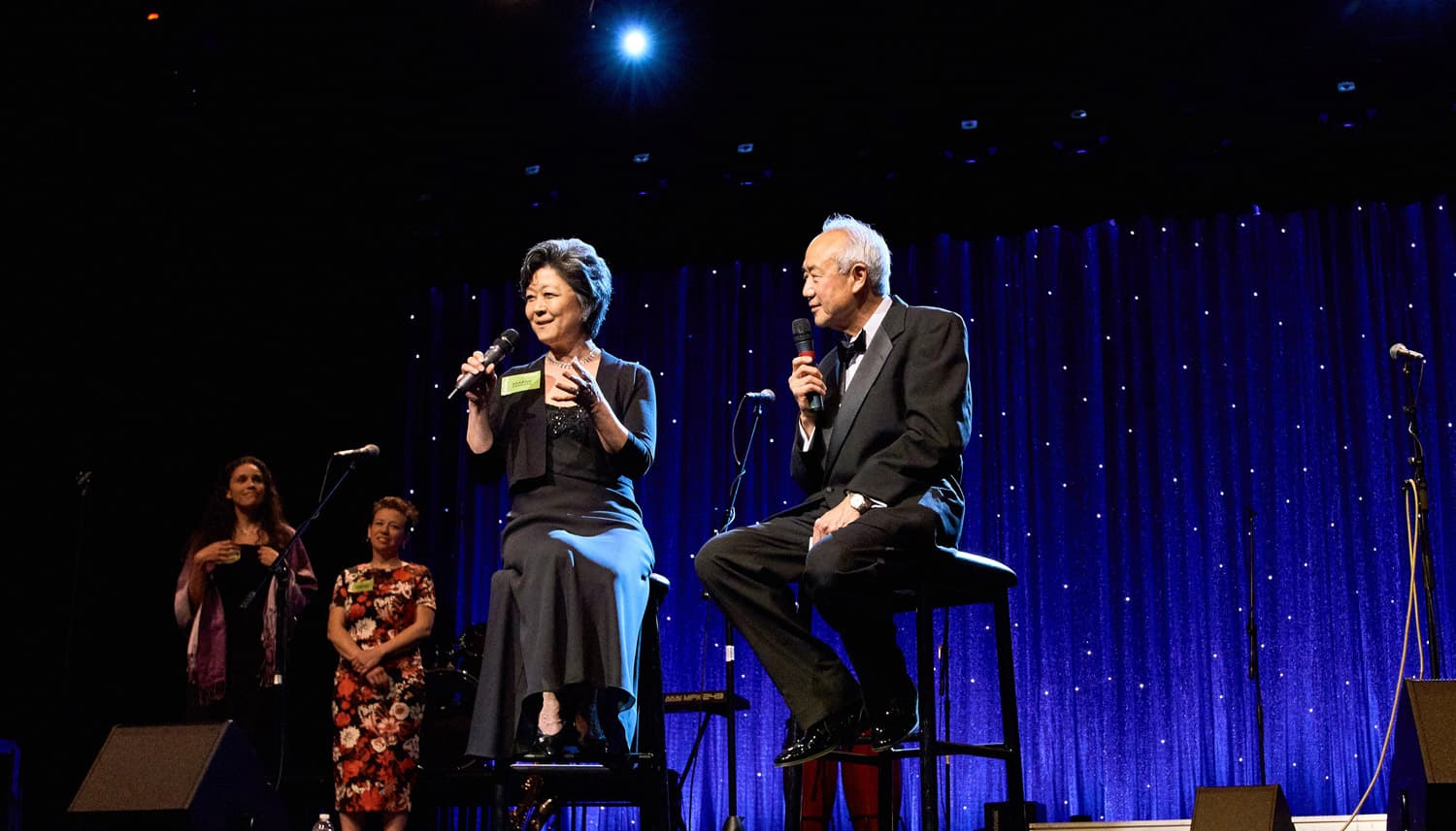 Sharon Okamoto '76, MEd '79 is interviewed by Chi-Dooh "Skip" Li '66 at SPU's 125th anniversary gala.