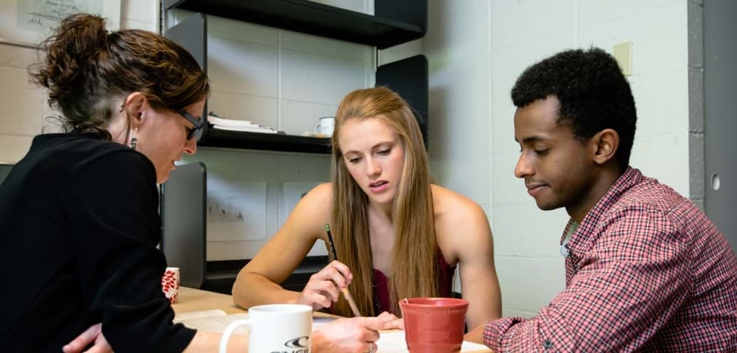 Three philosophy majors study together.