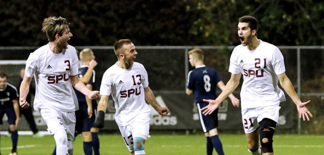 Falcon men's soccer team celebrate a play