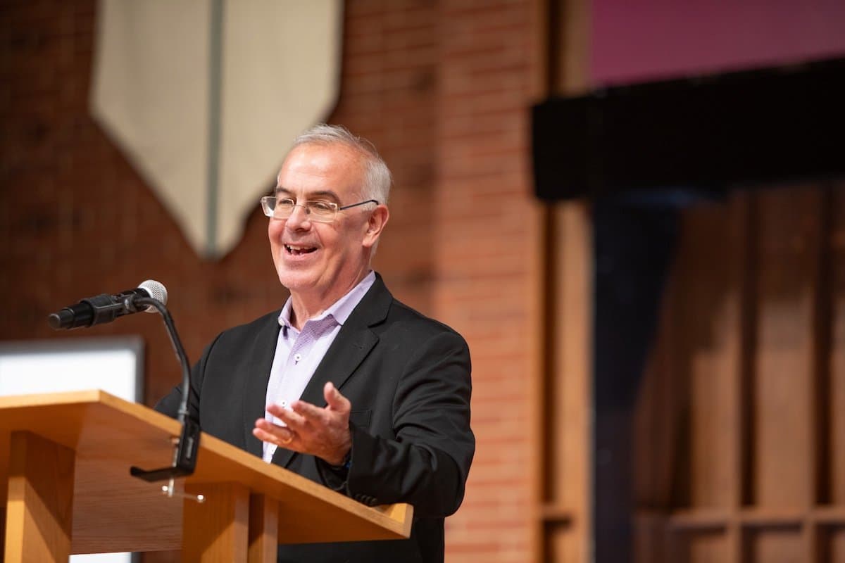 David Brooks speaking at podium in First Free Methodist Church