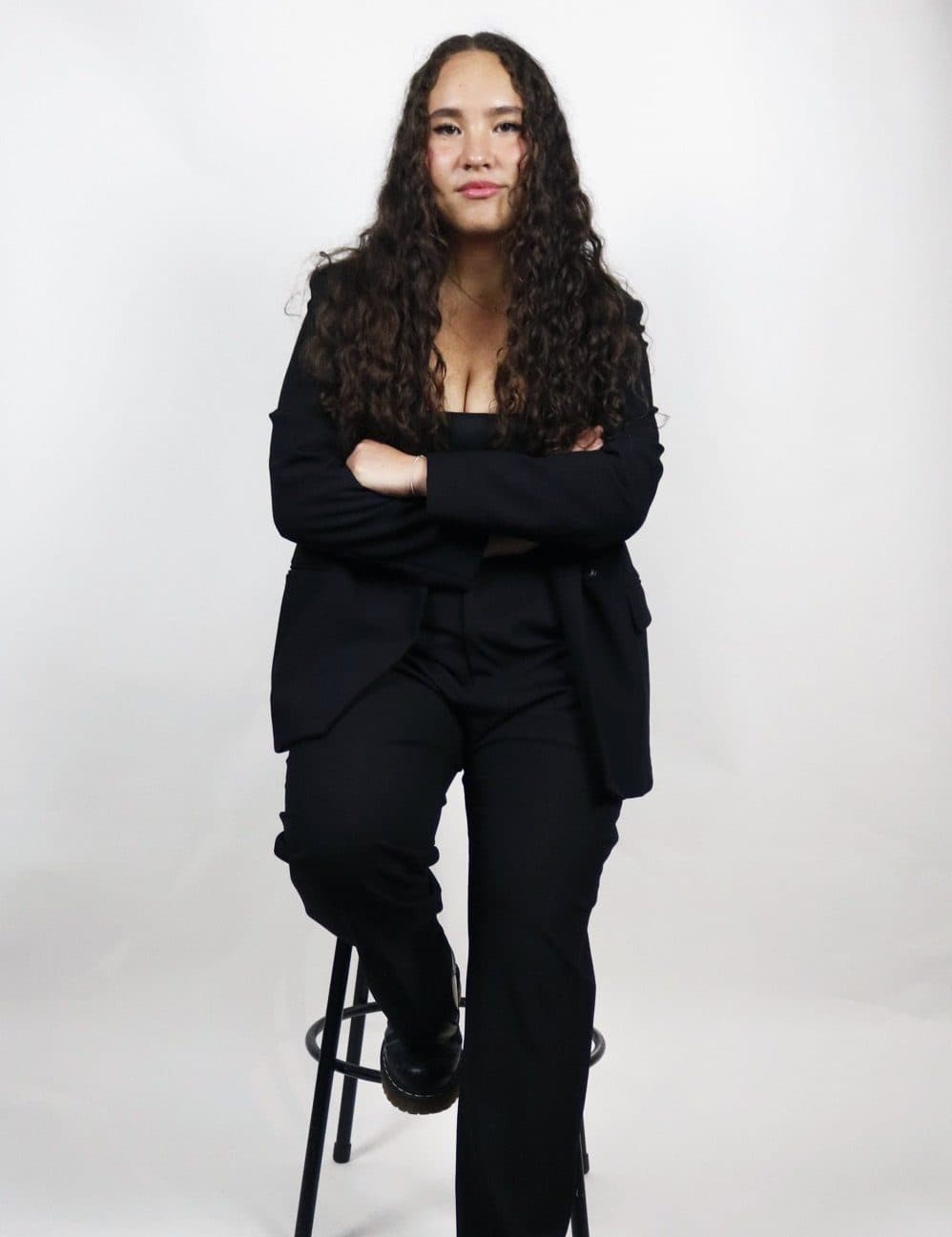 Annabelle Sukin leaning on a stool