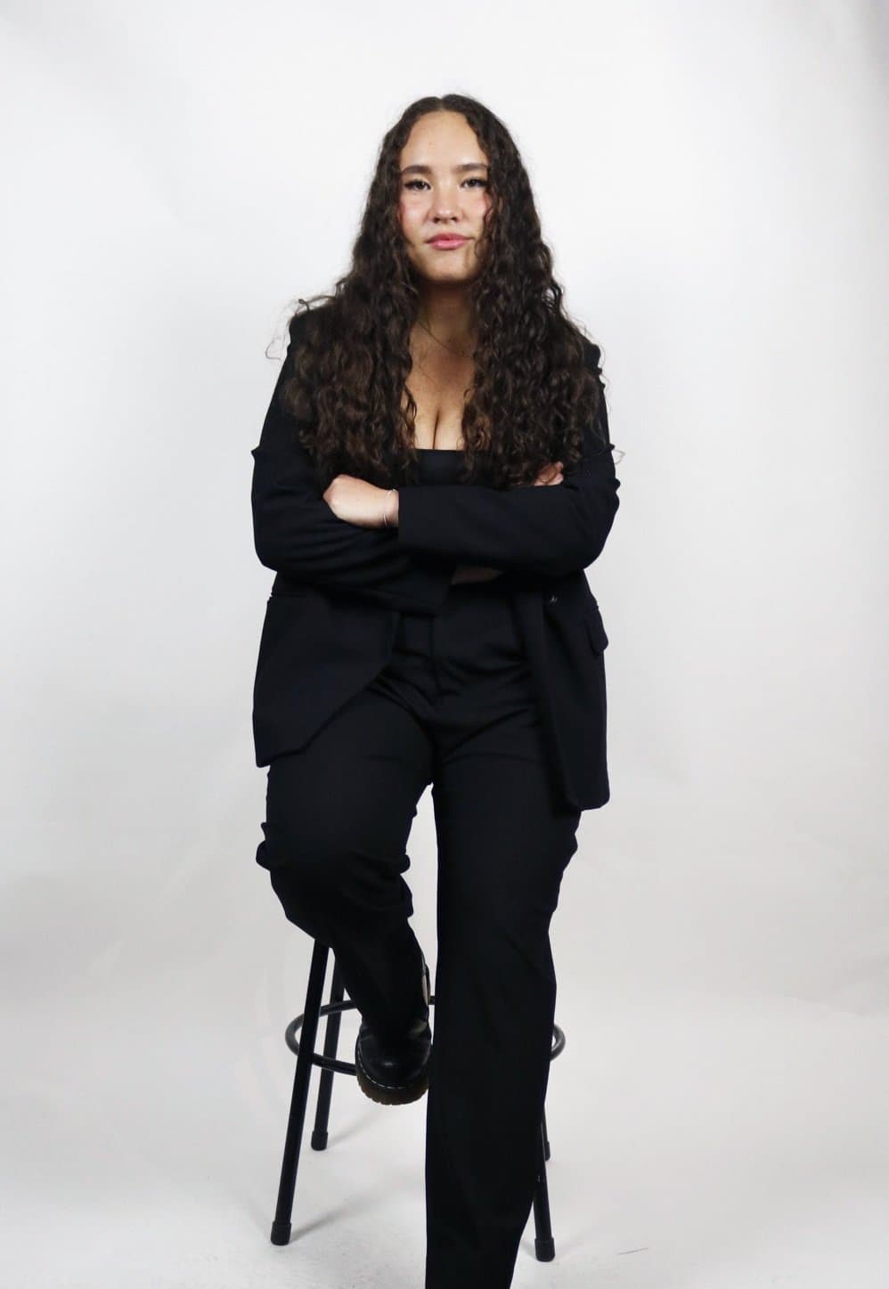 Annabelle Sukin leaning on a stool