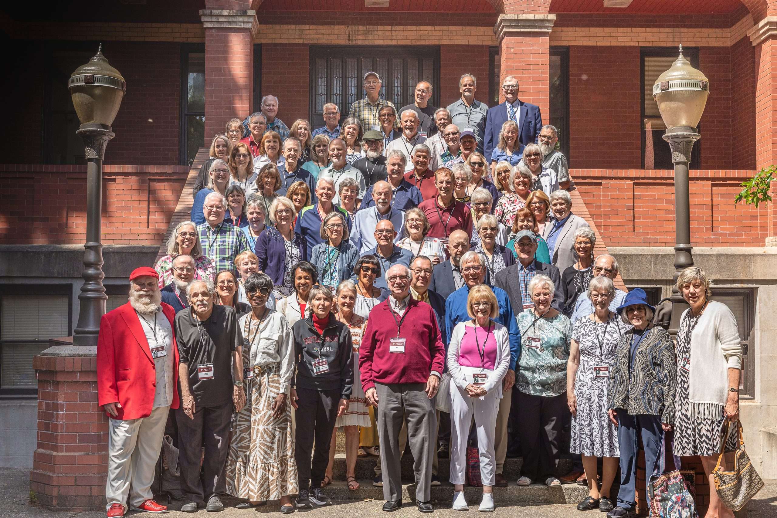 Class of 1975 alumni on the steps of Peterson Hall.