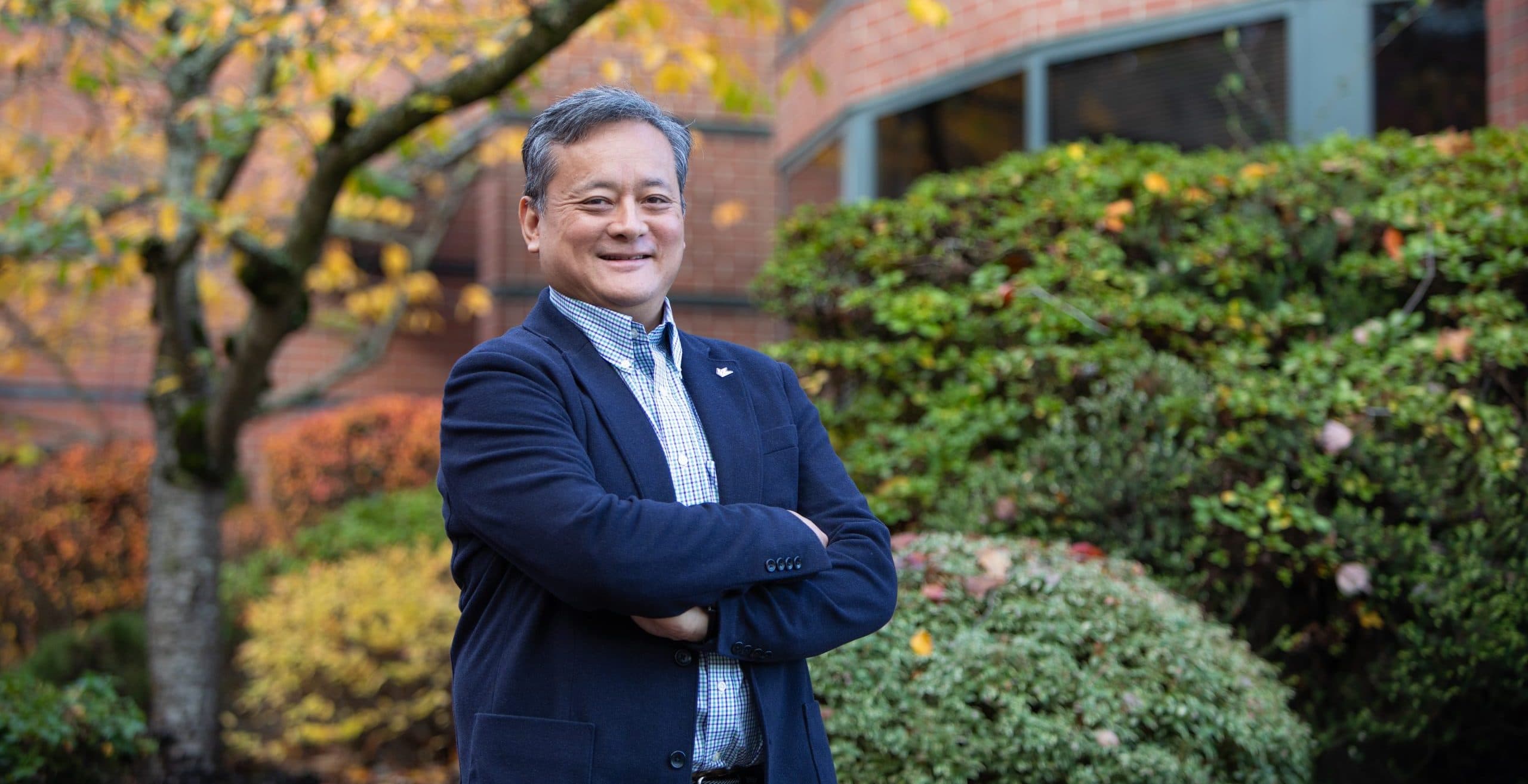 Dr. James Yeh, dean of the College of Business and Technology, in front of McKenna Hall.
