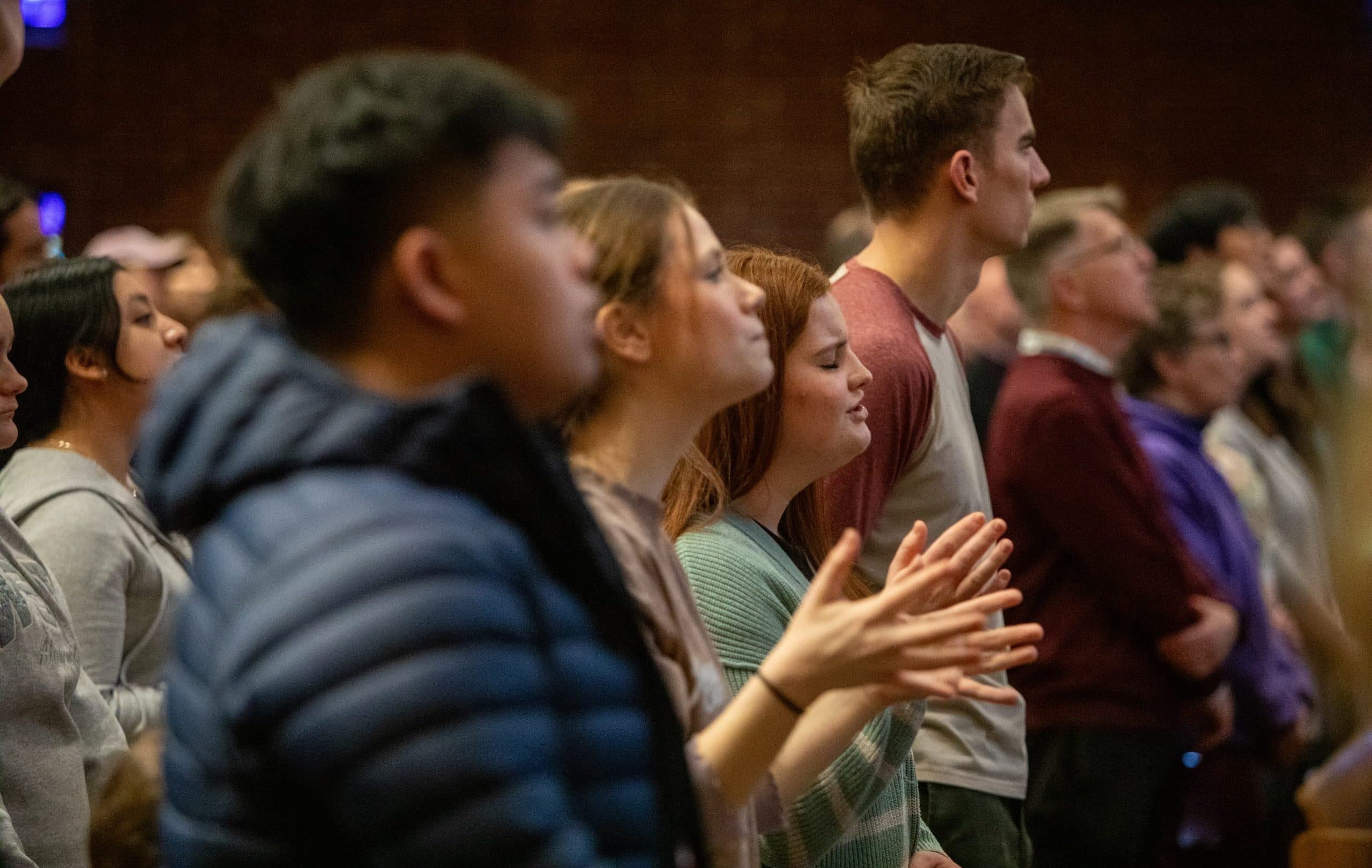 SPU community members singing at chapel