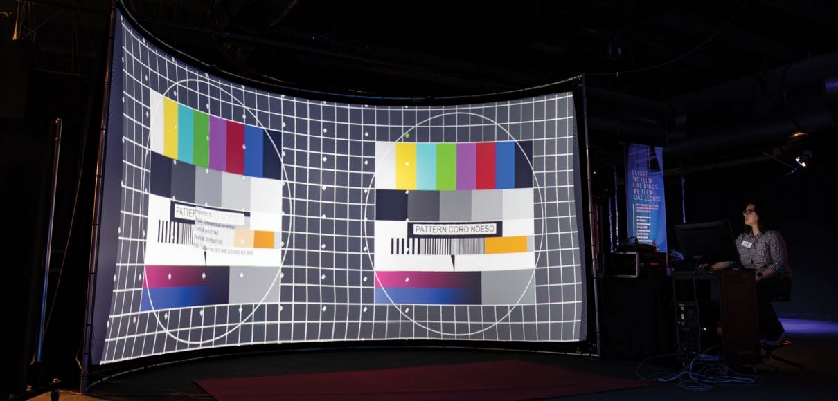Lisa Marchisio calibrates the projection software for the curved screen