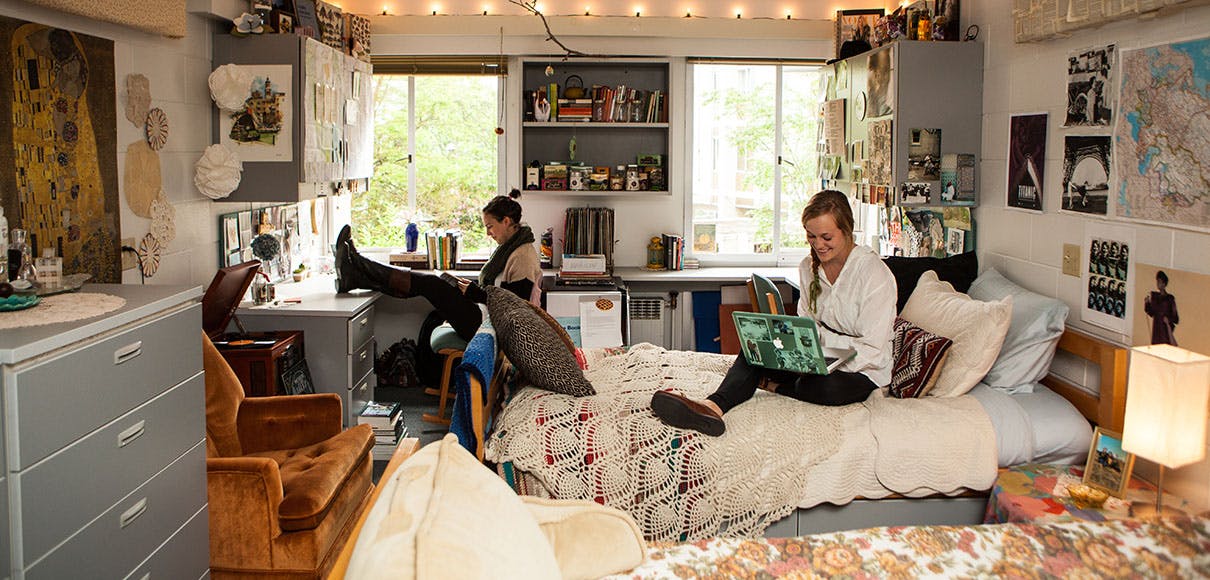 Two SPU students hang out in their dorm room