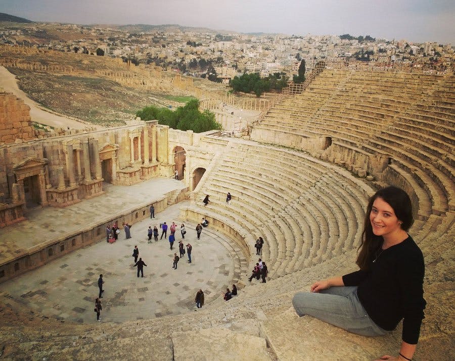 Student sitting in Greek amphitheater