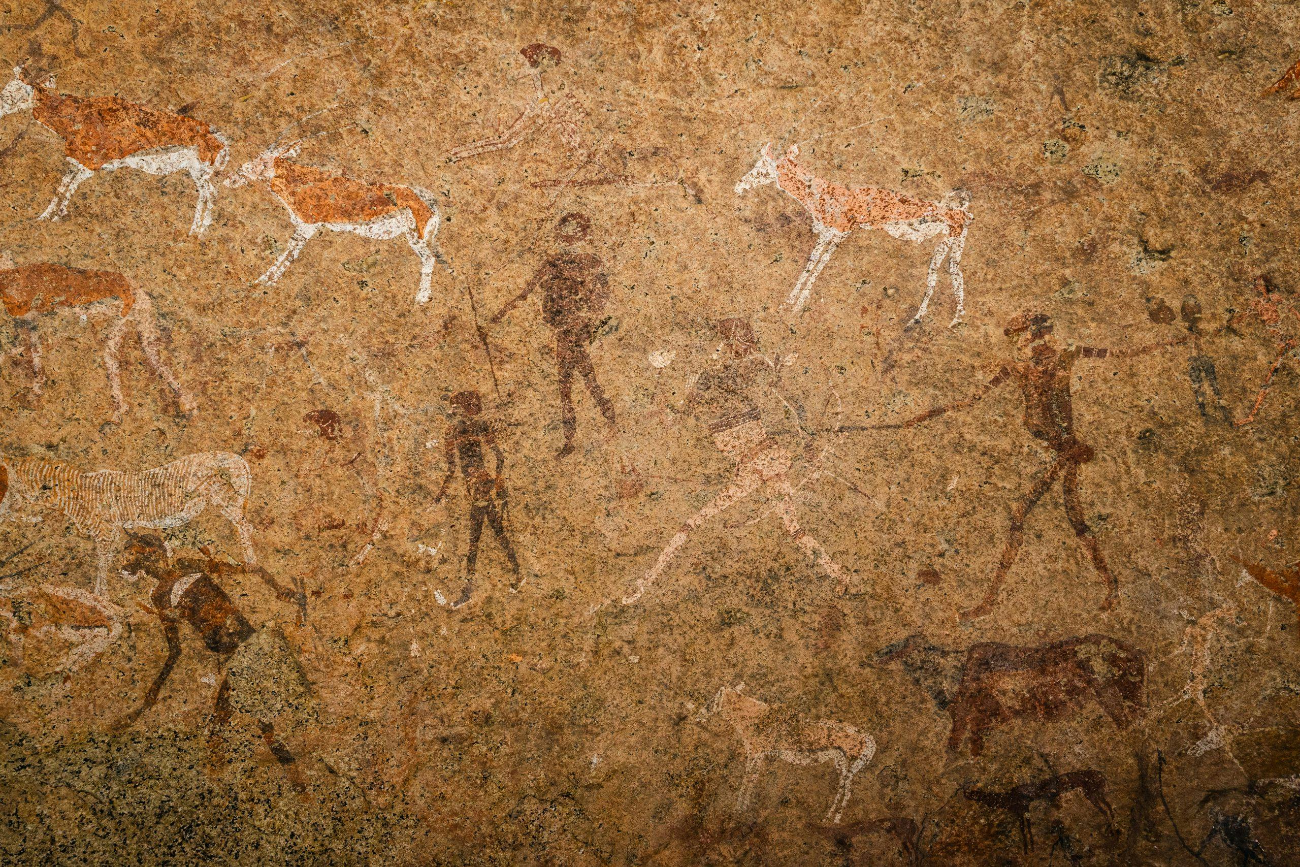 ancient drawings of human figures hunting