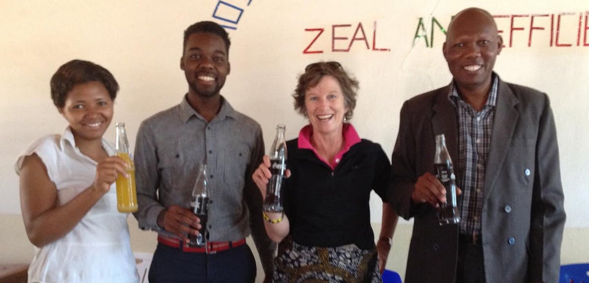 From left: Adelyn; Peace Corps volunteer Ryan; Cynthia Strong; and Mr. Komba, headmaster of the Chamwino Secondary School.